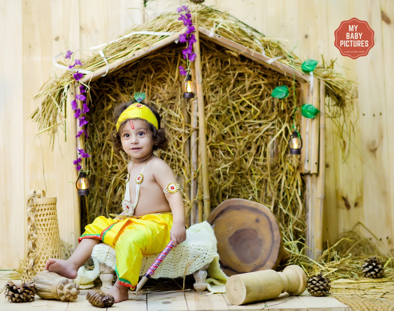 Cute baby boy in Krishna dress for a Kutiya theme baby photoshoot